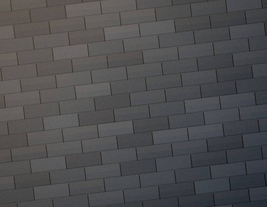 Illustrative sample image for a fictional website concept: a close view of slate-gray roof shingles in low sunlight.